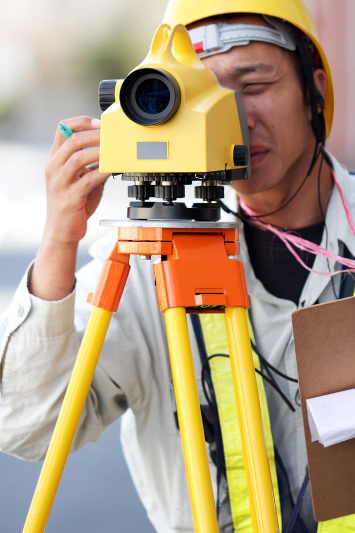 Surveyor working with digital level